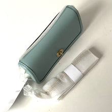 Load image into Gallery viewer, Green electronic device with a strap on a white background