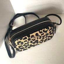 Load image into Gallery viewer, Leopard print handbag with black strap on a white background