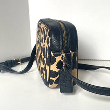 Load image into Gallery viewer, Leopard print handbag with black accents on a white background