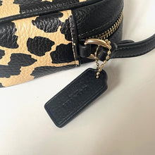 Load image into Gallery viewer, Close-up of a leopard print handbag with a black tag and gold chain on a white background
