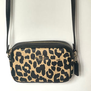 Leopard print crossbody bag on a white background
