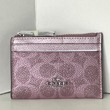 Load image into Gallery viewer, Pink Coach wallet on a light gray background