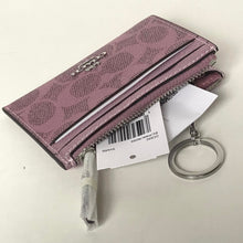 Load image into Gallery viewer, Pink wallet with keychain and tag on a white background