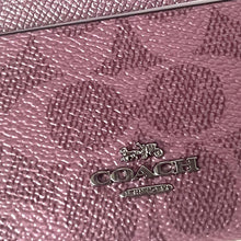 Load image into Gallery viewer, Close-up of a pink textured surface with a silver 'LOVE' charm.