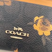 Load image into Gallery viewer, Coach wallet with logo and floral design