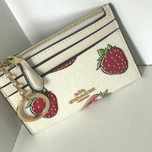 Load image into Gallery viewer, White wallet with strawberry design and keychain on a white background
