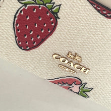 Load image into Gallery viewer, Product with strawberry design and visible brand logo on a beige background