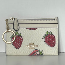 Load image into Gallery viewer, Coach cardholder with strawberry pattern and keychain on a light gray background