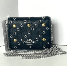 Load image into Gallery viewer, Coach handbag with chain strap on a white background