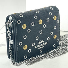 Load image into Gallery viewer, Blue Coach handbag with gold and silver studs and a chain strap on a white background