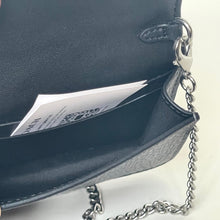 Load image into Gallery viewer, Navy blue handbag with a chain detail on a light background