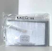 Load image into Gallery viewer, Coach pouch in clear packaging on a white background