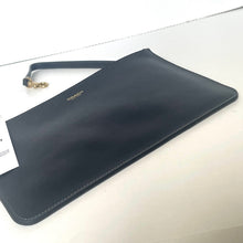 Load image into Gallery viewer, Navy blue Coach wallet on a light gray surface