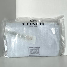 Load image into Gallery viewer, Coach pouch in clear packaging on a white background