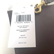 Load image into Gallery viewer, Product tag on a brown leather bag with gold hardware