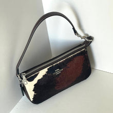 Load image into Gallery viewer, Handbag with cowhide pattern on a white background