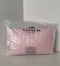 Load image into Gallery viewer, Pink Coach pouch in clear packaging on a gray background
