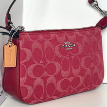 Load image into Gallery viewer, Red Coach handbag with logo pattern on a light background