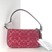 Load image into Gallery viewer, Red Coach handbag with a matching tag on a white background