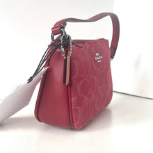 Load image into Gallery viewer, Red handbag with Coach logo on a white background
