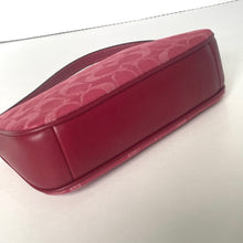 Load image into Gallery viewer, Red leather case with floral pattern on a white background