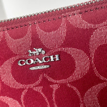 Load image into Gallery viewer, Close-up of a red Coach wallet with a visible logo.