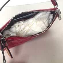 Load image into Gallery viewer, Red handbag with a white flower inside on a light pink background