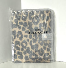 Load image into Gallery viewer, Coach notebook with leopard print design in packaging on a white background