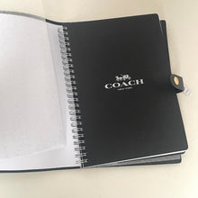 Load image into Gallery viewer, Black Coach notebook with a visible brand logo on a light background