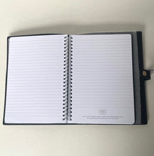 Load image into Gallery viewer, Open notebook with lined pages on a light beige background