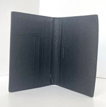 Load image into Gallery viewer, Black leather wallet with textured surface on a white background