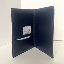 Load image into Gallery viewer, Navy blue leather wallet with brand label on a white background