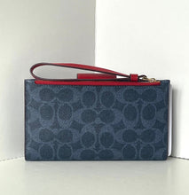 Load image into Gallery viewer, Blue patterned clutch with red interior and handle on a white background