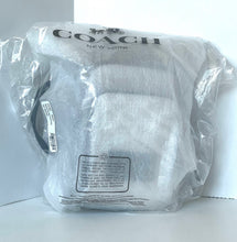 Load image into Gallery viewer, Coach bag in clear plastic packaging on a white background