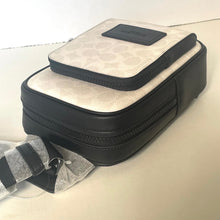 Load image into Gallery viewer, Black and beige crossbody bag on a light background