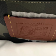 Load image into Gallery viewer, Coach logo on a leather product with text