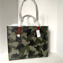 Load image into Gallery viewer, Camouflage-patterned bag with red handles on a white background