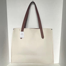 Load image into Gallery viewer, Beige tote bag with brown handles on a white background