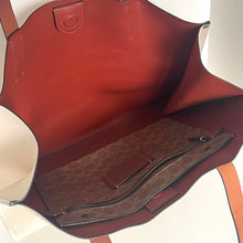 Load image into Gallery viewer, Close-up of a red leather bag with a patterned interior.