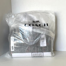 Load image into Gallery viewer, Coach New York bag in clear plastic packaging on a white background
