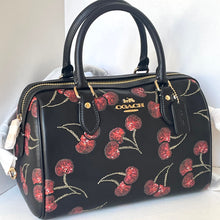 Load image into Gallery viewer, Coach handbag with cherry pattern on a white background