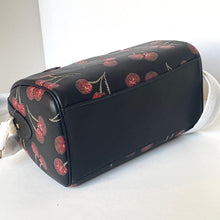 Load image into Gallery viewer, Black handbag with cherry pattern on a white background
