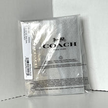 Load image into Gallery viewer, Coach packaging with clear plastic wrap on a white background