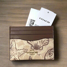Load image into Gallery viewer, Coach cardholder with a patterned design on a white background