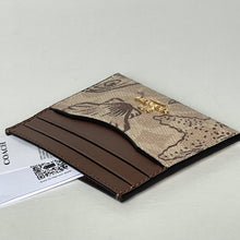 Load image into Gallery viewer, Brown leather cardholder with floral design on a light gray background