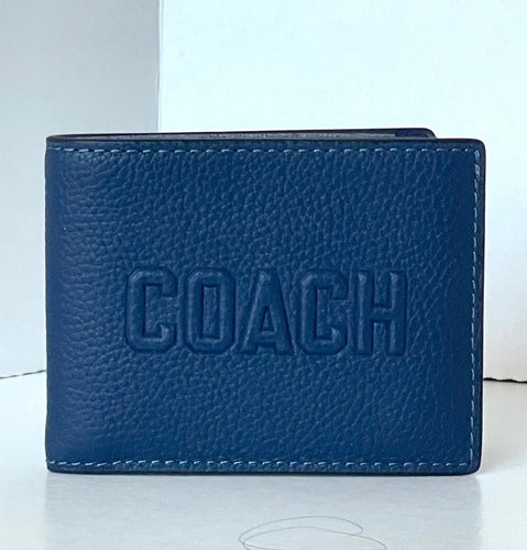 Blue leather wallet with 'COACH' embossing on a white background