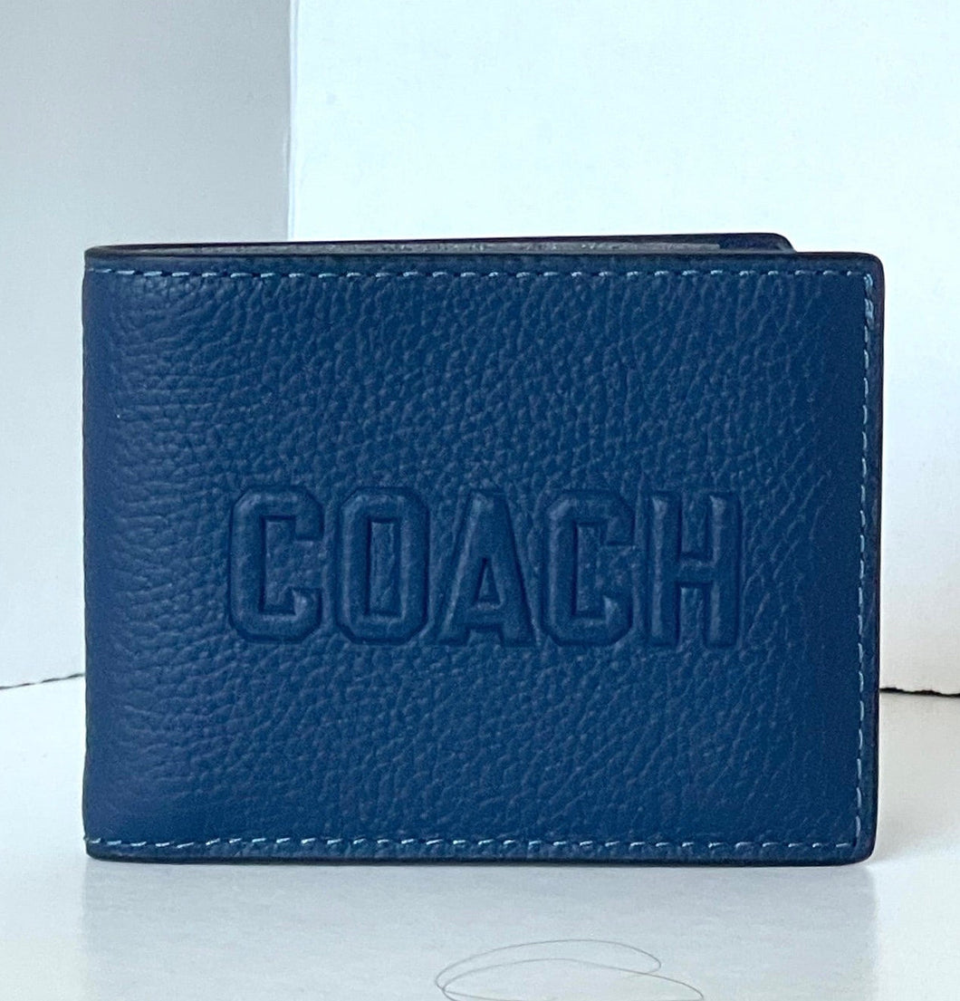 Blue leather wallet with 'COACH' embossing on a white background