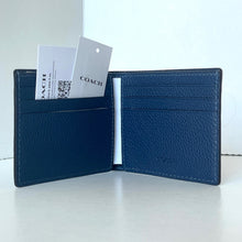 Load image into Gallery viewer, Blue leather wallet with a Coach card and white background
