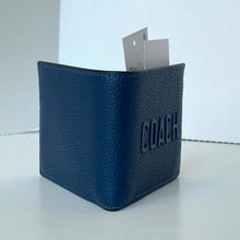 Load image into Gallery viewer, Blue leather wallet with &#39;Coach&#39; branding on a white background
