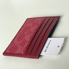 Load image into Gallery viewer, Red Coach wallet with a white tag on a light gray background